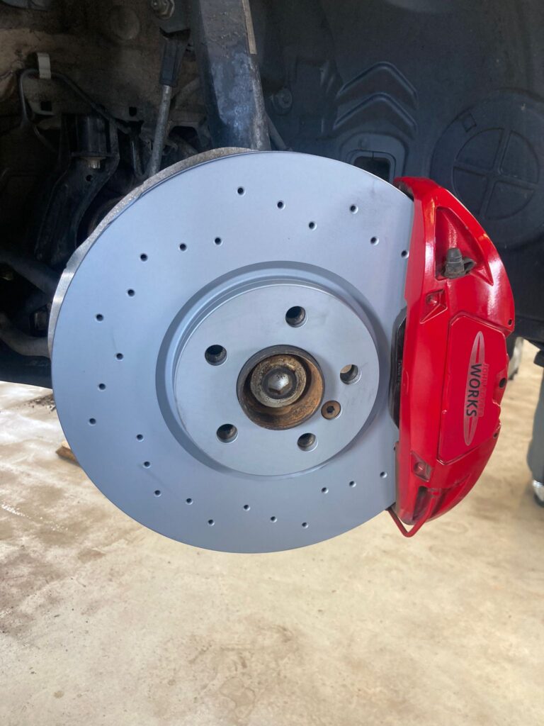 JCW braking system with drilled brake disc and red brake calliper